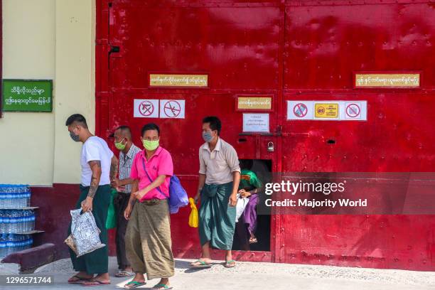 Prisoners who are released are coming out from the Obo prison in Mandalay, Myanmar.