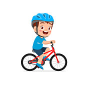 happy cute little kid boy riding bicycle