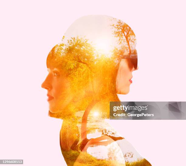 multiple exposure of woman with two faces - two face stock pictures, royalty-free photos & images