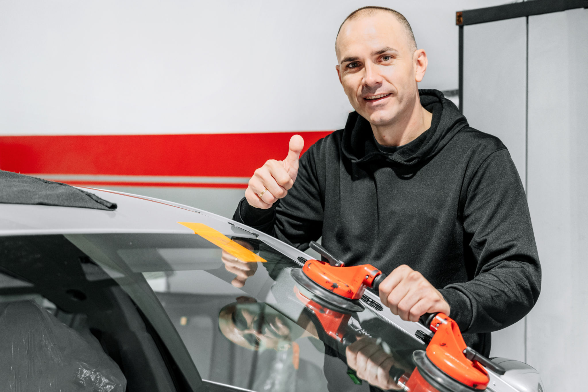 technician repairing windshield