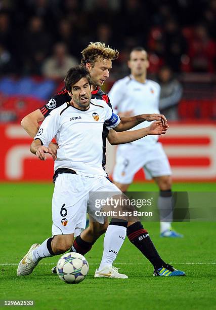 David Albelda of Valencia is challenged by Simon Rolfes of LEverkusen during the UEFA Champions League group E match between Bayer 04 Leverkusen and...