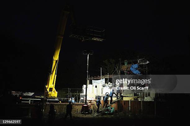 Bailiffs make their way onto Dale Farm, past the main barricade, during the eviction of Dale Farm travellers camp on October 19, 2011 near Basildon,...