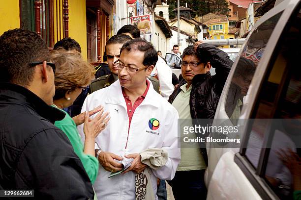 Gustavo Petro, candidate for mayor of Bogota, greets voters at a campaign event in Bogota, Colombia, on Saturday, Oct. 15, 2011. Petro, the candidate...