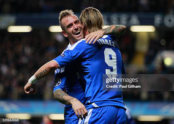 Fernando Torres of Chelsea celebrates with Raul Meireles as he scores their third goal during the UEFA Champions League group E match between Chelsea...