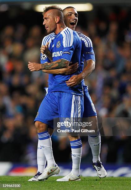 Raul Meireles of Chelsea celebrates with team mate Oriol Romeu as he scores their first goal during the UEFA Champions League group E match between...