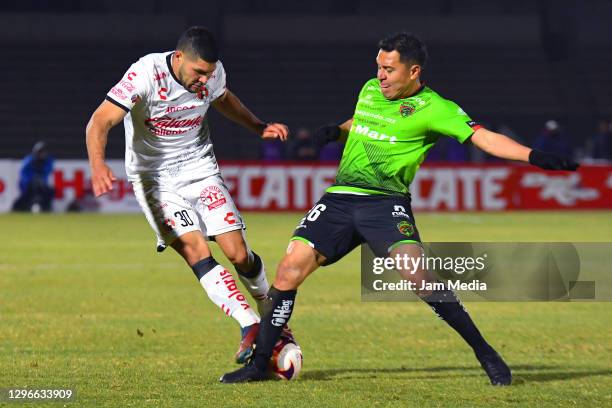 David Barbona of Tijuana fights for the ball with Alberto Acosta of Juarez during the 2nd round match between FC Juarez and Club Tijuana as part of...
