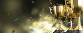 Golden trophy cup on dark background. copy space for text. 3d rendering.