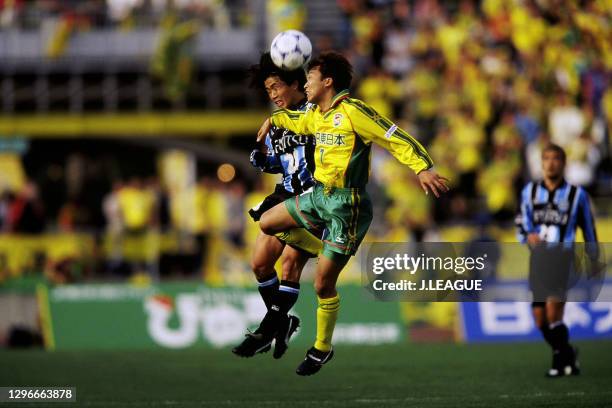 Akira Konno of Kawasaki Frontale and Shinichi Muto of JEF United Ichihara compete for the ball during the J.League J1 first stage match between JEF...