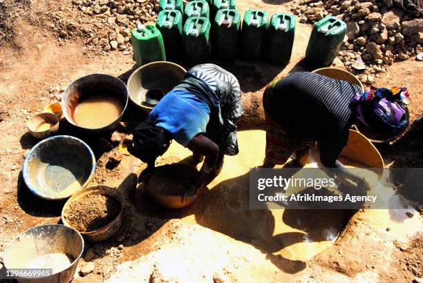 Malian women working at an artisanal gold mining site in Sadiola . Gold attracts many young people from the region to its mining sites where gold...