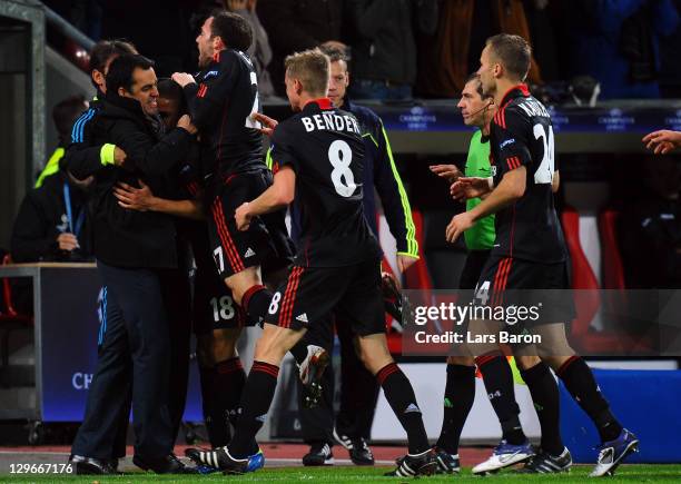 Sidney Sam of Leverkusen celebrates with head coach Robin Dutt after scoring his teams second goal during the UEFA Champions League group E match...