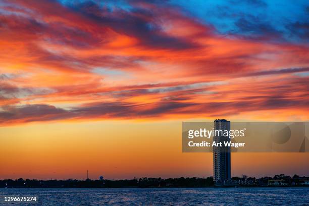 one highrise building at sunset - galveston texas stock pictures, royalty-free photos & images