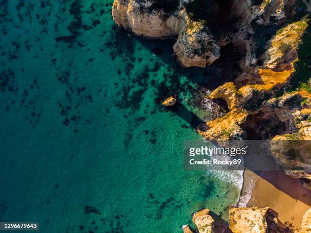 amazing drone shot of beautiful ponta da piedade in lagos, portugal - ponta da piedade imagens e fotografias de stock
