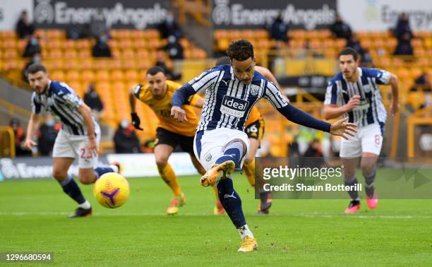 Matheus Pereira of West Bromwich Albion scores a penalty for his team's first goal during the Premier League match between Wolverhampton Wanderers...