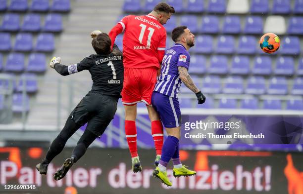 Kenan Karaman of Düsseldorf scores his team's second goal past Martin Maennel and Calogero Rizzuto of Aue during the Second Bundesliga match between...