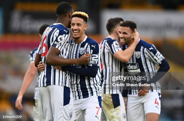 Callum Robinson of and Semi Ajayi of West Bromwich Albion celebrate following their sides victory after the Premier League match between...