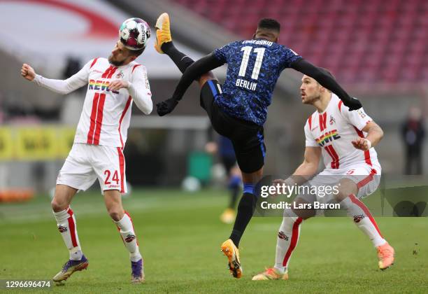 Dominick Drexler of 1. FC Koeln is challenged by Dodi Lukebakio of Hertha BSC during the Bundesliga match between 1. FC Koeln and Hertha BSC at...