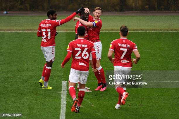 Famara Diedhiou of Bristol City celebrates with teammates Hakeeb Adelakun, Tomas Kalas, Zak Vyner and Chris Martin after scoring his team's first...