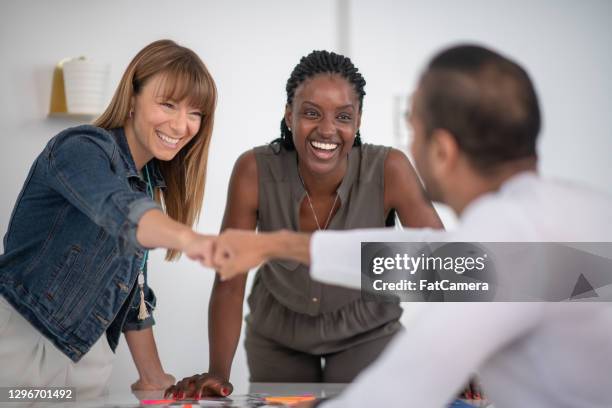 that's a great idea! - fist bump stock pictures, royalty-free photos & images