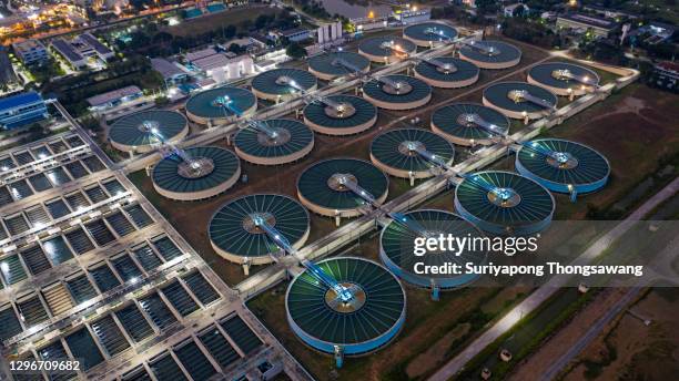 aerial view water treatment plant at night for environment conservation. - 浄水 ストックフォトと画像