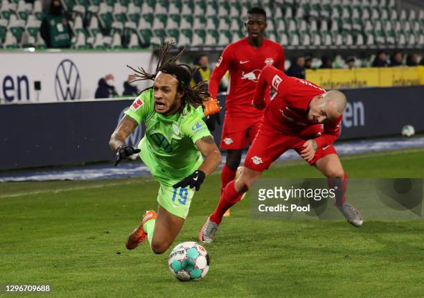 Kevin Mbabu of VfL Wolfsburg is challenged by Angelino of RB Leipzig during the Bundesliga match between VfL Wolfsburg and RB Leipzig at Volkswagen...