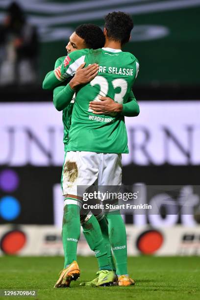 Felix Agu of SV Werder Bremen celebrates with team mate Theodor Gebre Selassie after scoring their side's second goal during the Bundesliga match...