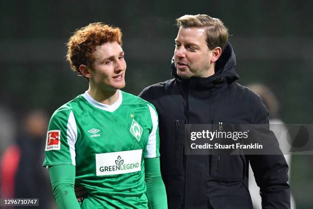 Florian Kohfeldt, Head Coach of SV Werder Bremen speaks with Joshua Sargent of SV Werder Bremen following the Bundesliga match between SV Werder...