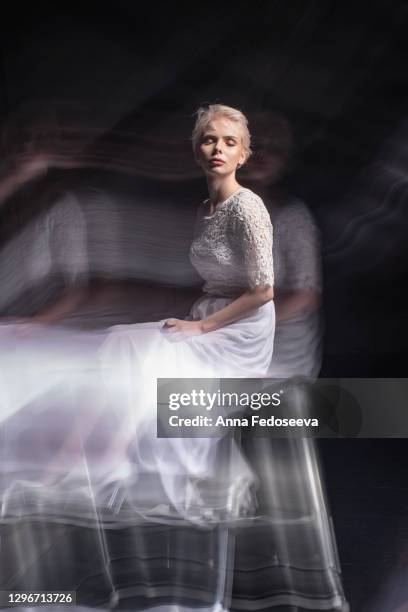 mixed light. girl in a white dress. games of light. art photo shooting. - actor backstage stock pictures, royalty-free photos & images