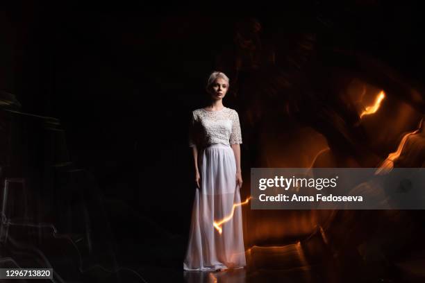 mixed light. girl in a white dress. games of light. art photo shooting. - spark singer stock pictures, royalty-free photos & images