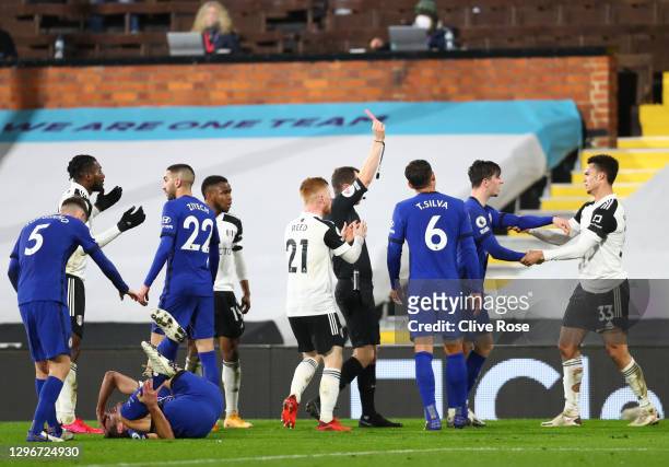 Antonee Robinson of Fulham is shown a red card and sent off by referee Peter Bankes after a foul on Cesar Azpilicueta of Chelsea during the Premier...
