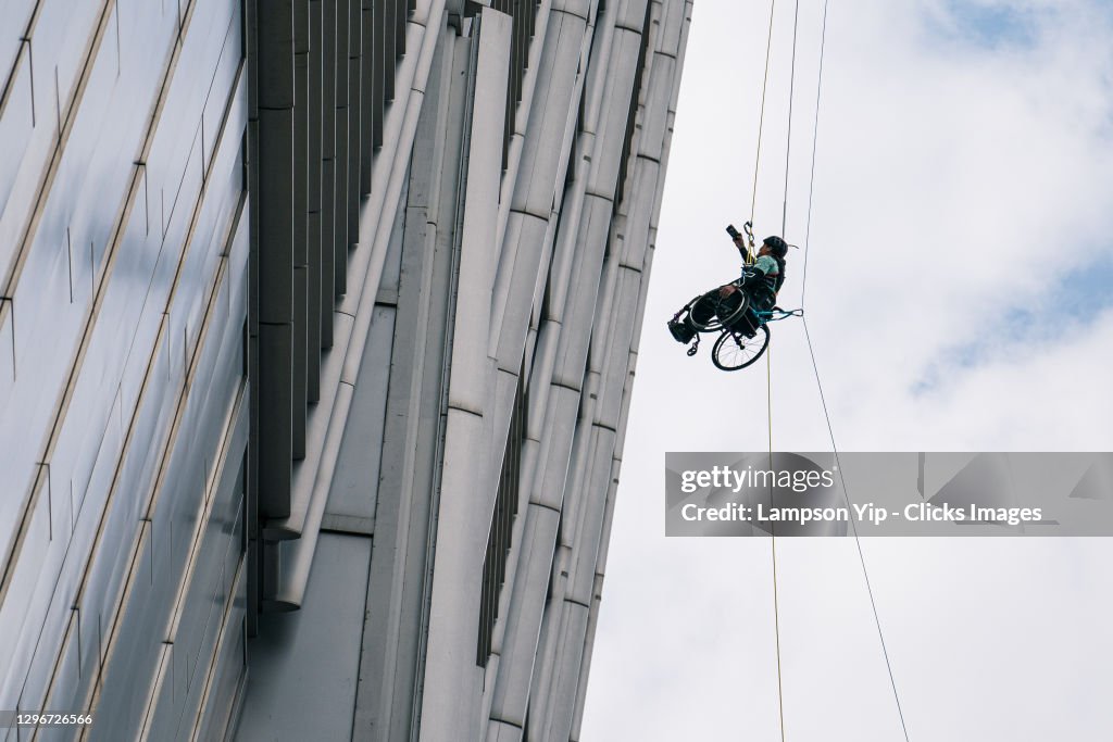 Wheelchair Climber Lai Chi-wai Challenges To Summit 320-Metre Skyscraper
