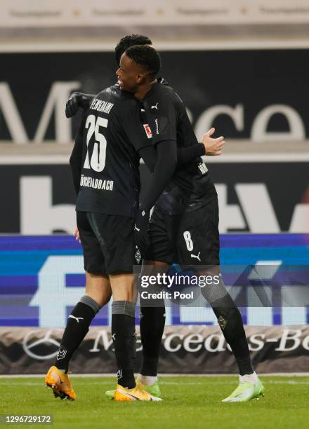 Denis Zakaria of Borussia Moenchengladbach celebrates with team mate Ramy Bensebaini after scoring their side's second goal past Gregor Kobel of VfB...