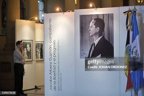 Man attends a photography exhibition dedicated to former Guatemalan President Jacobo Arbenz on October 19 at the Culture Palace in Guatemala City....