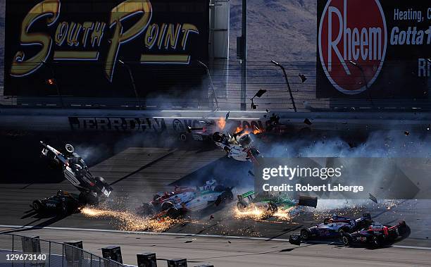 Image 22 in a sequence of 47 images of the crash in which Dan Wheldon of England driver of the Bowers & Wilkins Sam Schmidt Motorsports Dallara Honda...