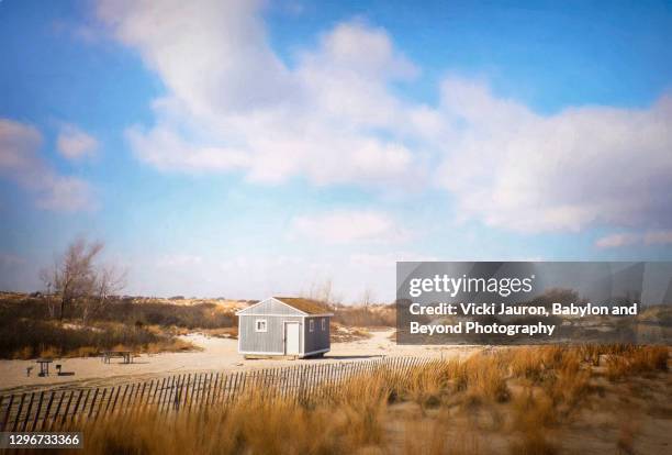 little beach shack in the sand on a beautiful day at jones beach - jones beach stock-fotos und bilder