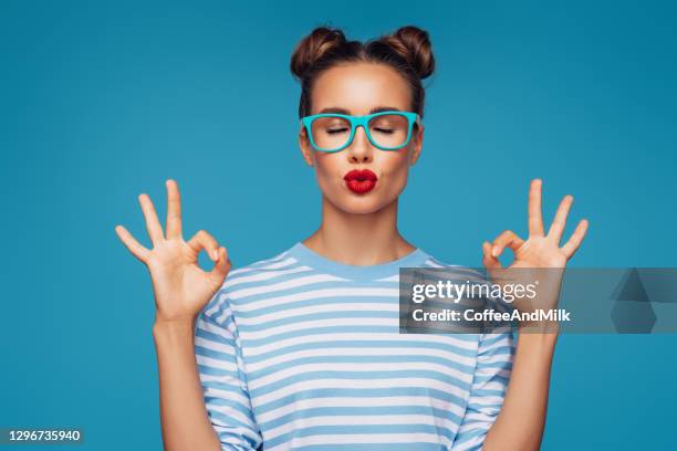 beautiful girl showing ok sign - gesturing ok stock pictures, royalty-free photos & images