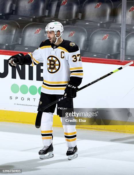Patrice Bergeron of the Boston Bruins celebrates his goal in the second period against the New Jersey Devils at Prudential Center on January 16, 2021...
