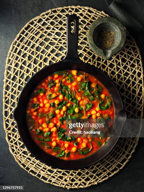 healthy vegan chickpea and spinach stew - stew stock pictures, royalty-free photos & images