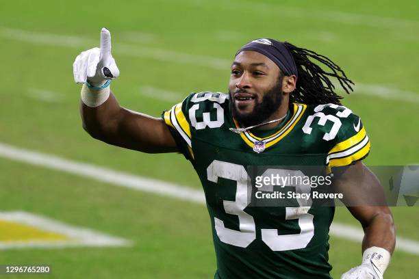 Aaron Jones of the Green Bay Packers reacts after defeating the Los Angeles Rams 32-18 in the NFC Divisional Playoff game at Lambeau Field on January...