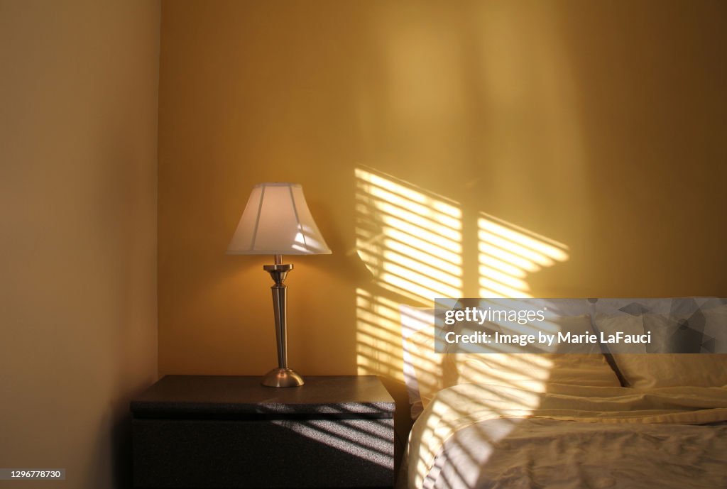 Bright sun shining through window in bedroom