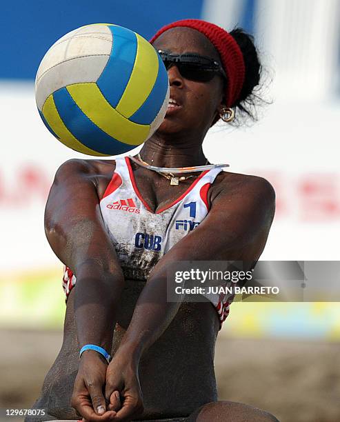 Niriam Sinal of Cuba returns the ball during a women's beach volleyball quarterfinals match against Puerto Rico during the XVI Pan American Games in...