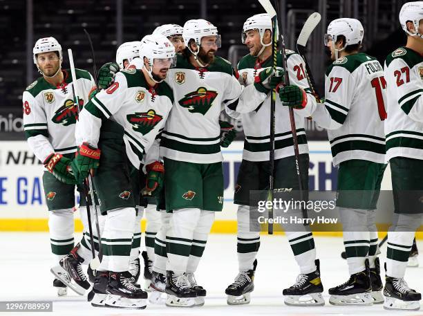 Marcus Johansson of the Minnesota Wild celebrates his game winning goal with Greg Pateryn and Carson Soucy during a 4-3 overtime win over the Los...