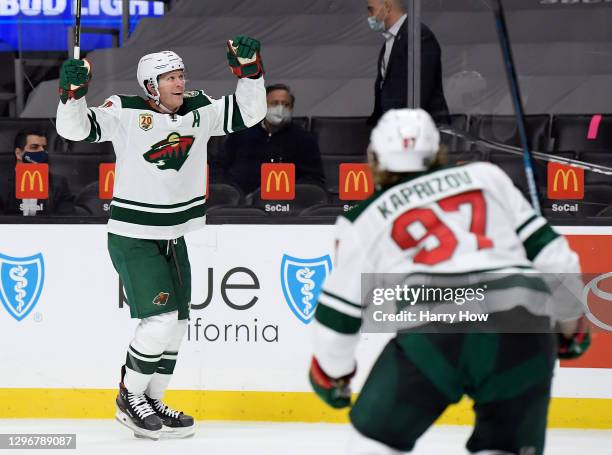 Ryan Suter of the Minnesota Wild reacts to his goal in front of Kirill Kaprizov, to tie the score 3-3 with the Los Angeles Kings, during a 4-3...