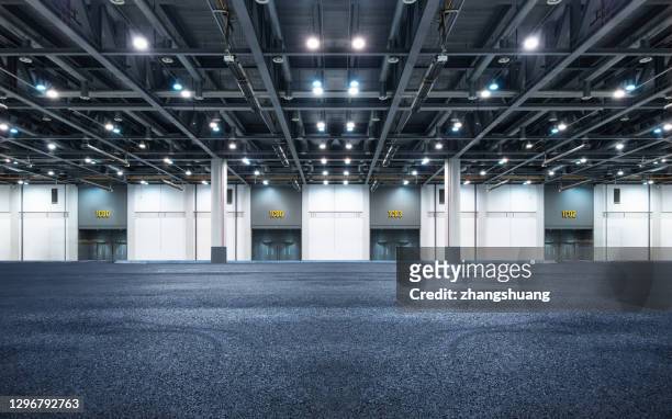 interior of empty warehouse - hangar stock-fotos und bilder