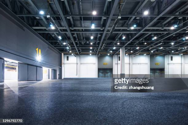 interior of empty warehouse - modern warehouse stock pictures, royalty-free photos & images
