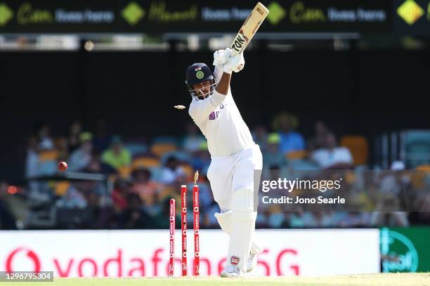 Shardul Thakur of India is bowled by Pat Cummins of Australia during day three of the 4th Test Match in the series between Australia and India at The...