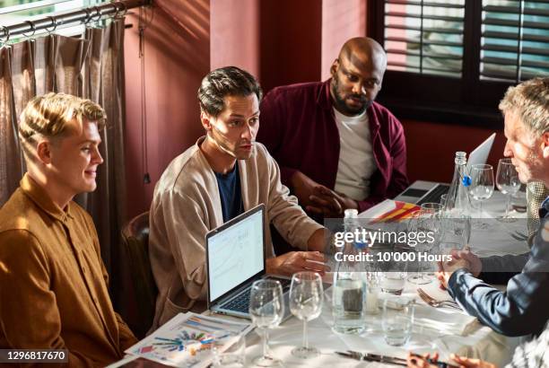 business colleagues meeting in restaurant with laptop - dining presentation food imagens e fotografias de stock