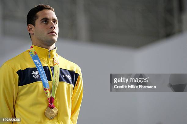 Thiago Pereira of Brazil stands on the podium after winning the gold medal in the men's 200m individual medley during Day Five of the XVI Pan...