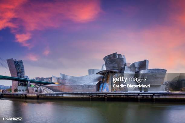 guggenheim bilbao museum over the nervion river - guggenheim museum stock pictures, royalty-free photos & images