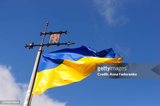 flag of ukraine in lviv city - ukraine stock pictures, royalty-free photos & images