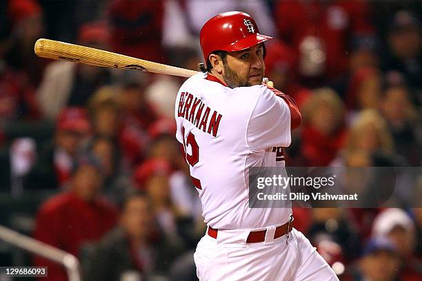 Lance Berkman of the St. Louis Cardinals hits a two-RBI single in the bottom of the fourth inning against the Texas Rangers during Game One of the...